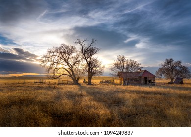 Old Farmhouse At Sunset On The Great Plains