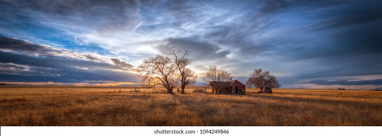 Old Farmhouse At Sunset On The Great Plains