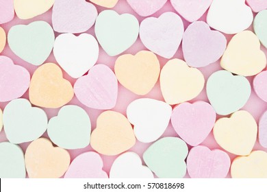 Old fashion pale multi colored candy heart background