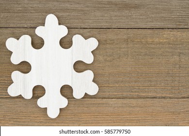 Old fashion snowflake background, A retro wood snowflake on weathered wood background with copy space for your message