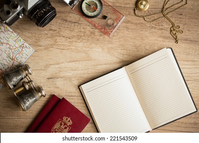 Old Fashionable Travel Stuff On Wooden Table