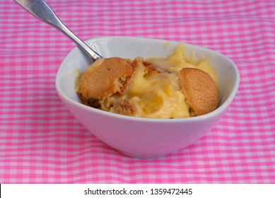 Old Fashioned Banana Pudding With Vanilla Wafers On Pink Gingham Table Cloth.