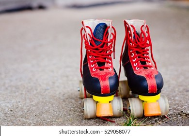 Old Fashioned Black And Red Roller Skates