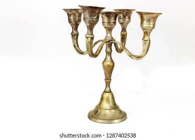 Old Fashioned Candle Stick Holders On A White Background 