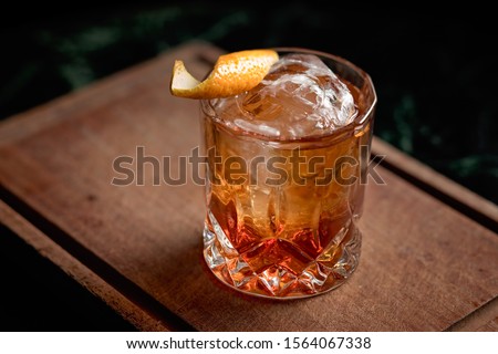 Old fashioned, classic cocktail served on the rocks 
