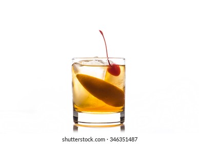 Old Fashioned Cocktail With Cherry And Orange Peel