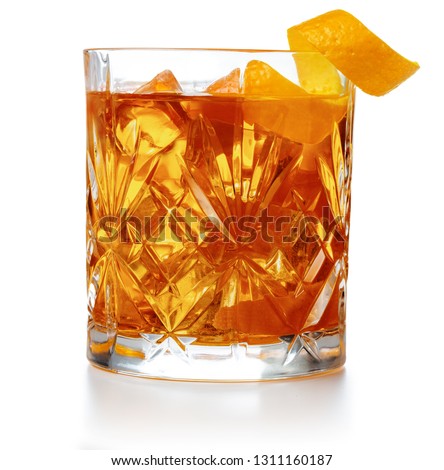 old fashioned cocktail garnished with orange twist isolated