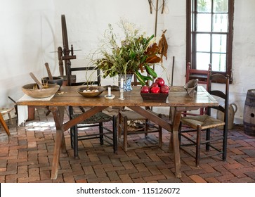 Old Fashioned Colonial Kitchen Table Chairs Food And Apples In White Room