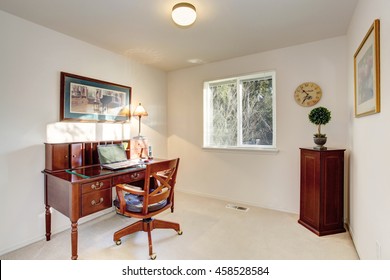 Old Fashioned Desk With Drawers In Home Office Interior With One Window And Beige Walls. Northwest, USA