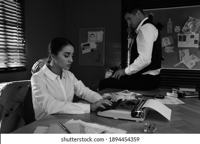 Old Fashioned Detective And Her Colleague Working In Office. Black And White Effect