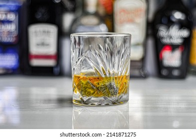 Old Fashioned Glass With Scotch Whisky And Ice Cubes On The Bar, Exclusive Drink