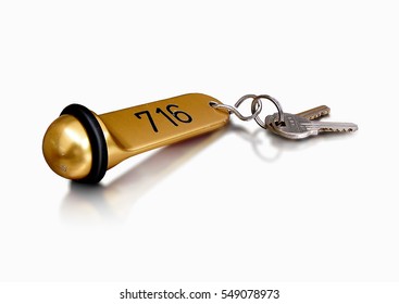 Old Fashioned Hotel Keys On A Large Brass Key Ring / Hotel Keys / Photographed On A Slightly Reflecting White Background
