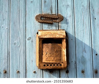 Old fashioned letterbox, against a wooden wall, with inscription LETTRES that means in English: letters - Powered by Shutterstock