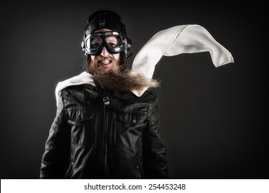 Old Fashioned Pilot With Goggles And A Scarf