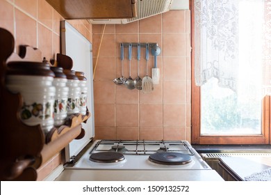 Old Fashioned Rustic Kitchen, Stove Top And Kitchen Utensils, Morning Sun Through A Lacy Window Curtain, Vintage Atmosphere  