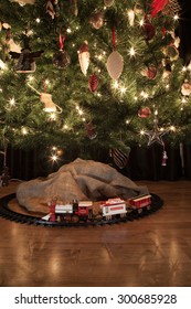 Old Fashioned Steam Locomotive Beneath A Decorated Christmas Tree, Vintage Feel 