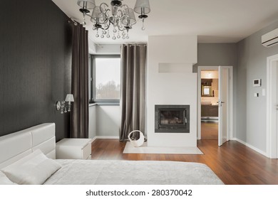 Old Fashioned Stylish Bedroom With Fireplace 