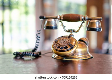 Old Fashioned Telephone On Table.