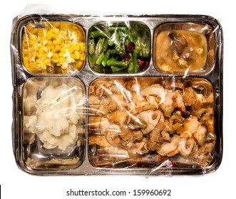 Old Fashioned Thanksgiving TV Dinner On Metal Tray Covered In Plastic