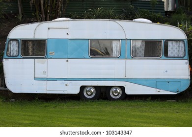An old fashioned trailer caravan parked in an outdoors campground. No People. Copy space