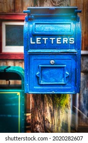 An Old Fashioned US Post Office Mail Box Hangs On A Telephone In Osaka, Japan.