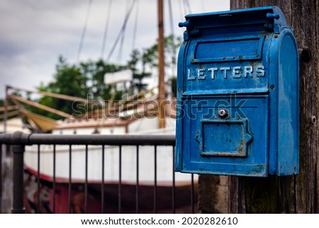 Similar – Image, Stock Photo Old mailbox of the student council with trash can and bulky waste on an old building in natural colors of the University Hospital Giessen on the Lahn in Hesse