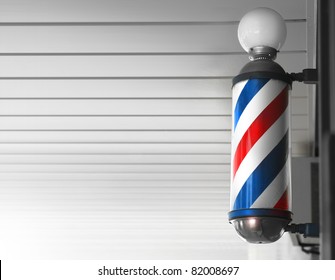 Old Fashioned Vintage Barber Shop Pole Against Modern Background