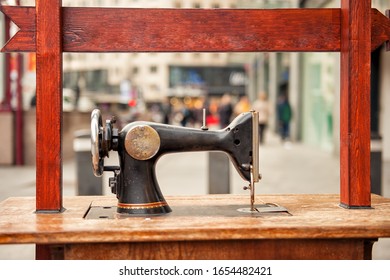 Old Fashioned Vintage Sewing Machine On Noisy Street In Antwerp, Belgium. Popular Travel Tourism Destination In Benelux.