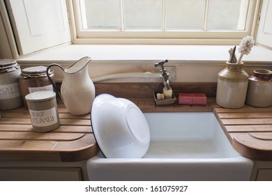 Old Fashioned Washing Up Sink With Vintage Cannisters