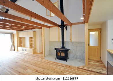 An old fashioned wood burning stove with a roaring fire-1-3