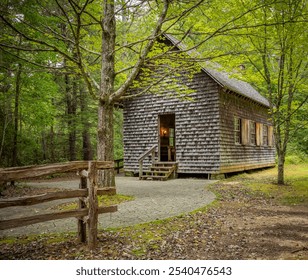 Old fashioned wood shingled house in the forest - Powered by Shutterstock