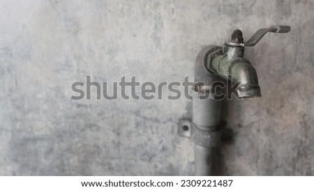 old faucet, a water faucet that is used to drain water from pipes