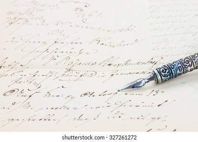 Old  Feather Pen On  Handwritten Letter Background