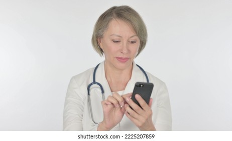 Old Female Doctor Browsing Smartphone On White Background