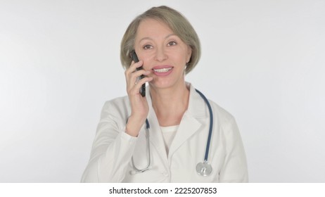 Old Female Doctor Talking On Phone On White Background