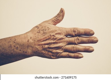 Old Female Hand Full Of Freckles With Vintage Tone 