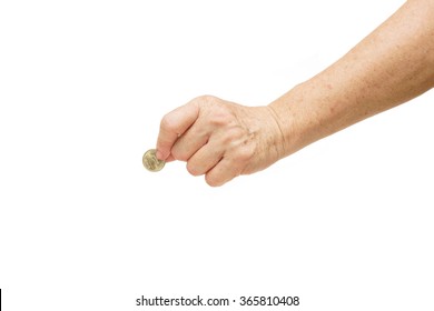 Old Female Hand Holding A Golden Coin