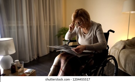 Old Female Trying To Read Newspaper In Eyeglasses, Eye Problem, Blurred Vision