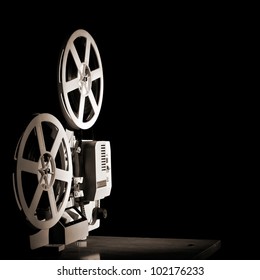 Old Film Projector On A Black Backgroun