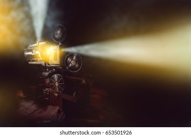 Old Film Projector With Smoke In Dark Room Background