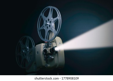  old film projector with stream of light
