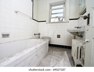 A Old, Filthy White Bathroom In An Abandoned House