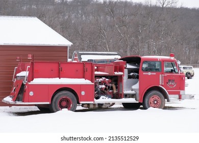 Old Fire Engine In A Snowy Rural Setting