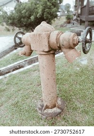 Old Fire Hydrant Worn Down By Time