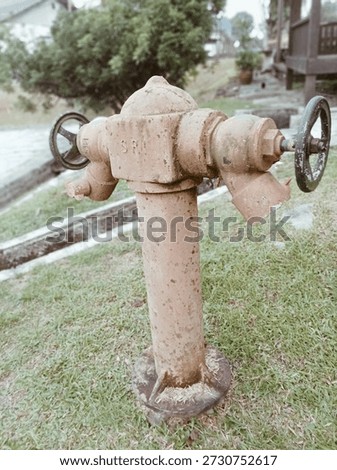 Old Fire Hydrant Worn Down By Time