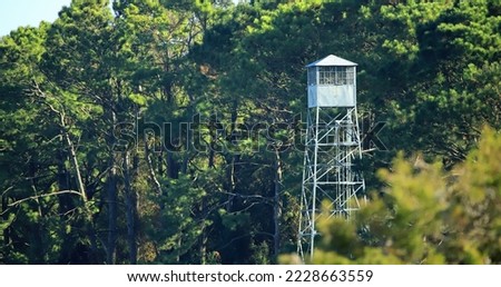 Old fire tower in the forest.