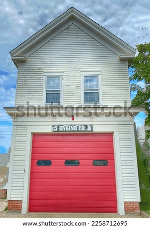 Old firehouse with red door in Provincetown, MA