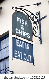 Old Fish and Chips Sign on Building Facade