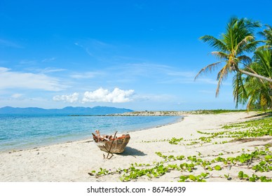 Old Fisherman Boat With Anchor On The Tropical Palm Beach