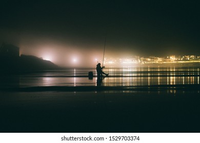 Old fisherman at night at ocean in Peniche - Powered by Shutterstock